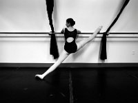 Felicia Garro, 15, stretches on the barre before staring her daily class at the New Bedford Ballet studio on Purchast Street in the north end of New Bedford.   [ PETER PEREIRA/THE STANDARD-TIMES/SCMG ]